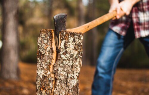 A man cutting wood with an axe