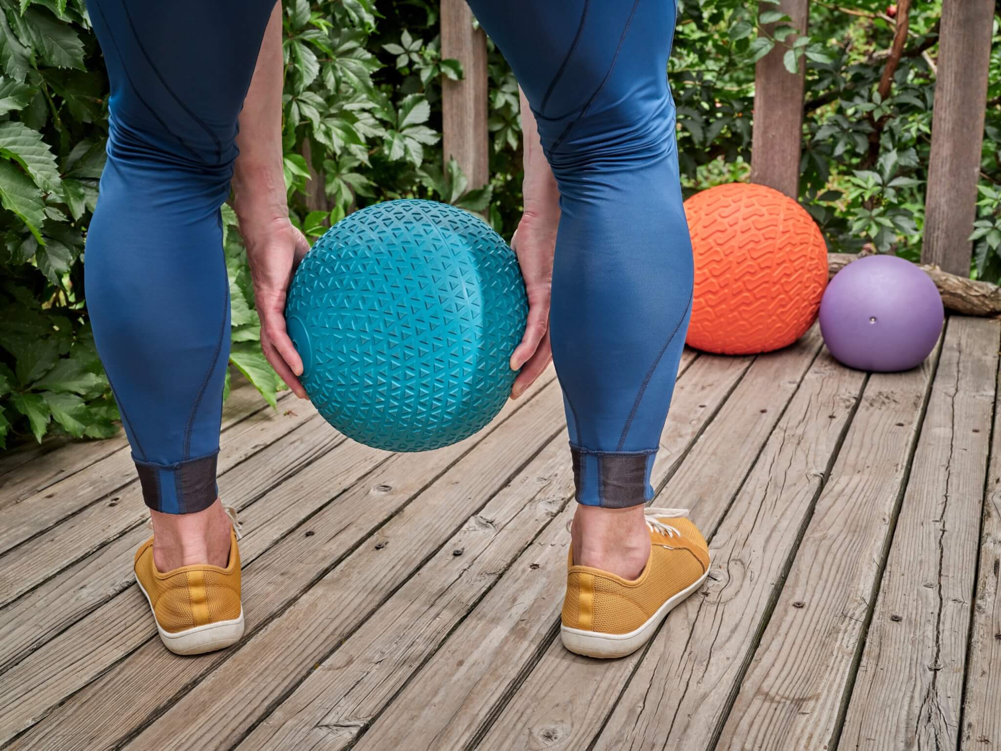 A man working out with a medicine ball