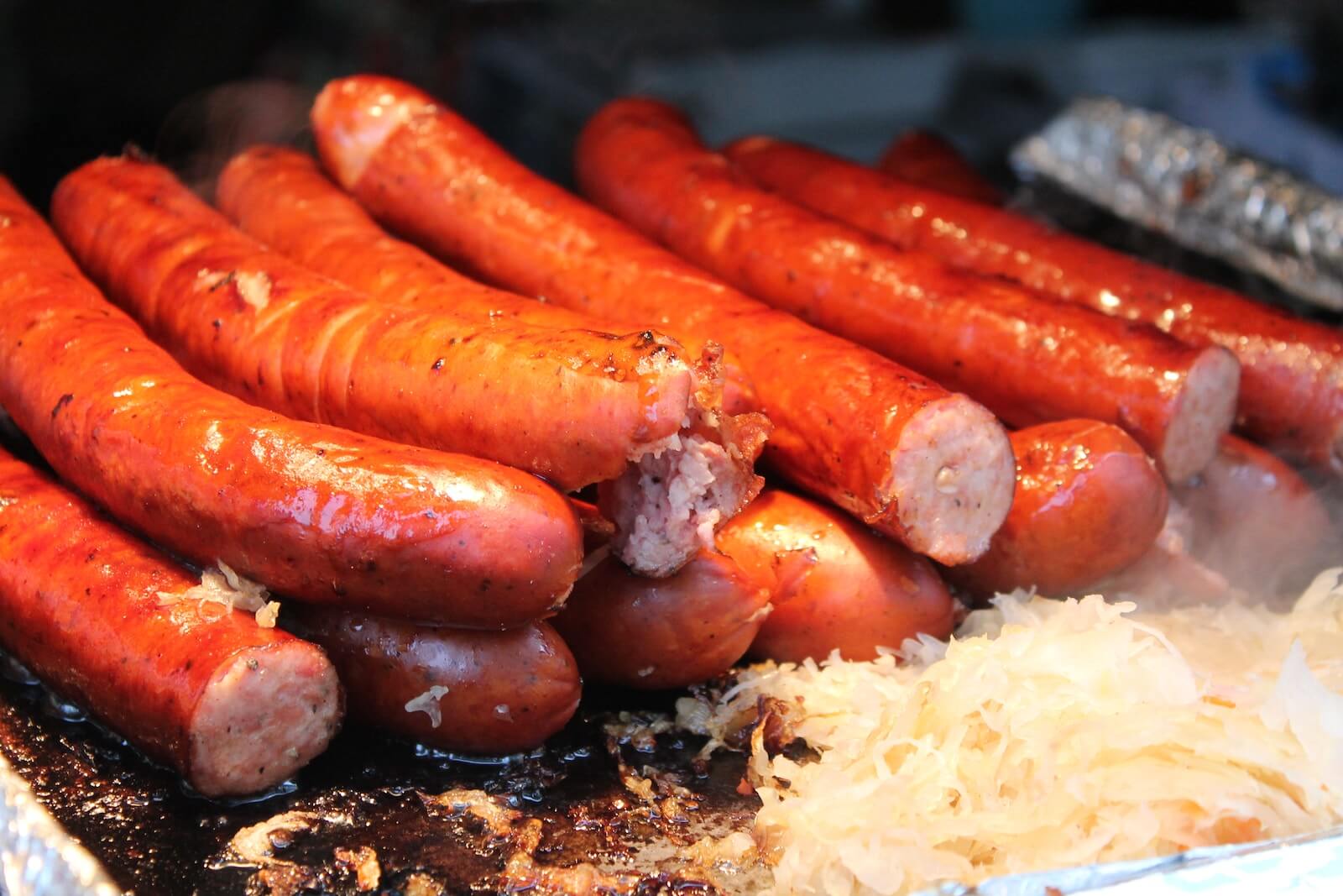 Bratwurst and sauerkraut on a grill