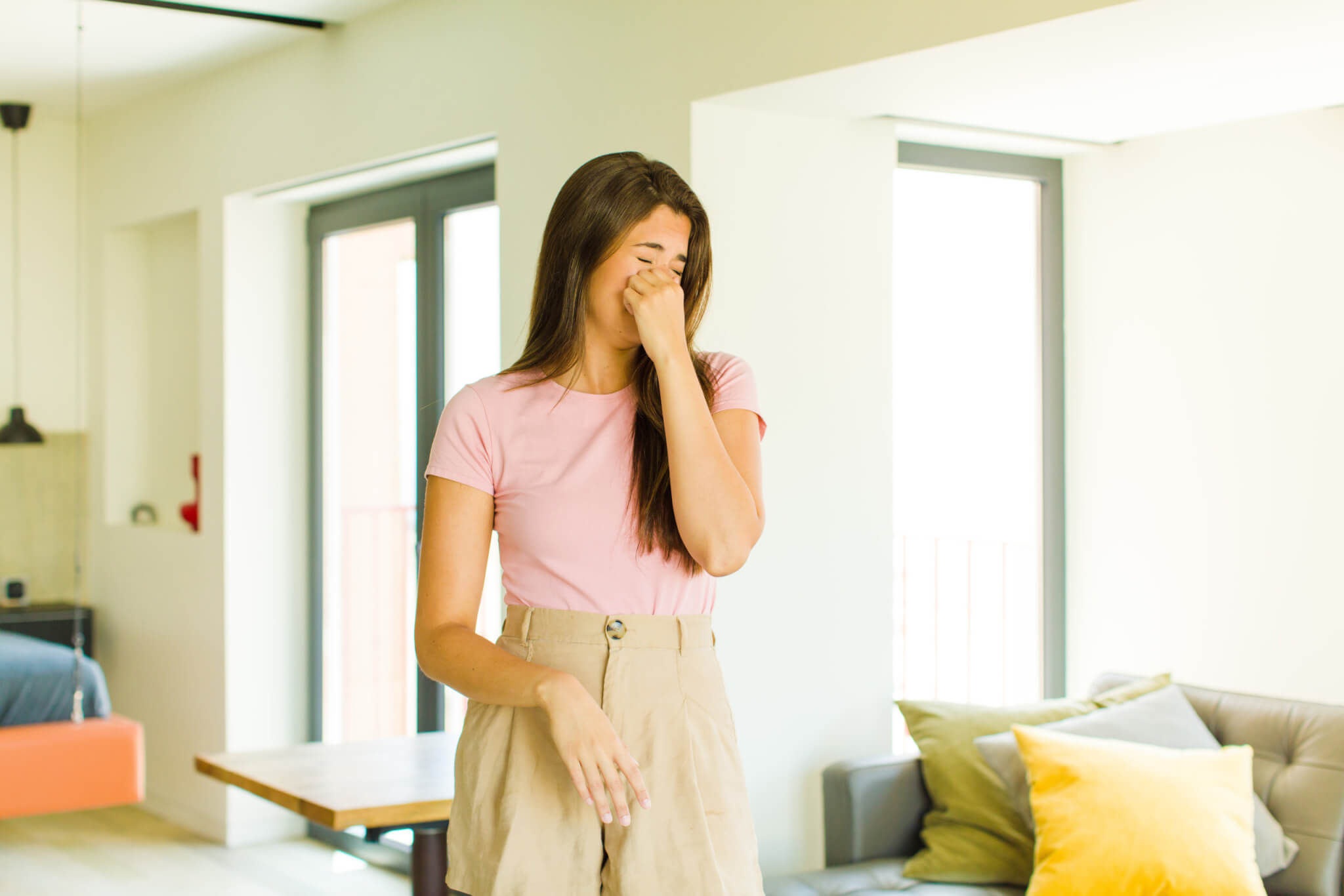 Stinky smell, woman holding nose over bad odor