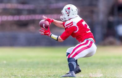 Football player catching the ball