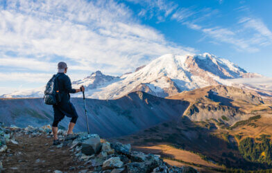 A hiker looking at Mount Rainier in Washington