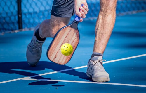 A man playing pickleball