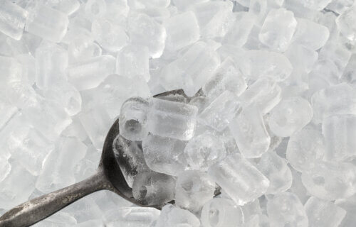 Ice scooper in ice cubes
