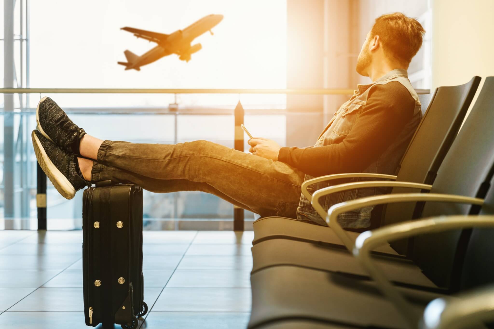 a man waiting for an airplane