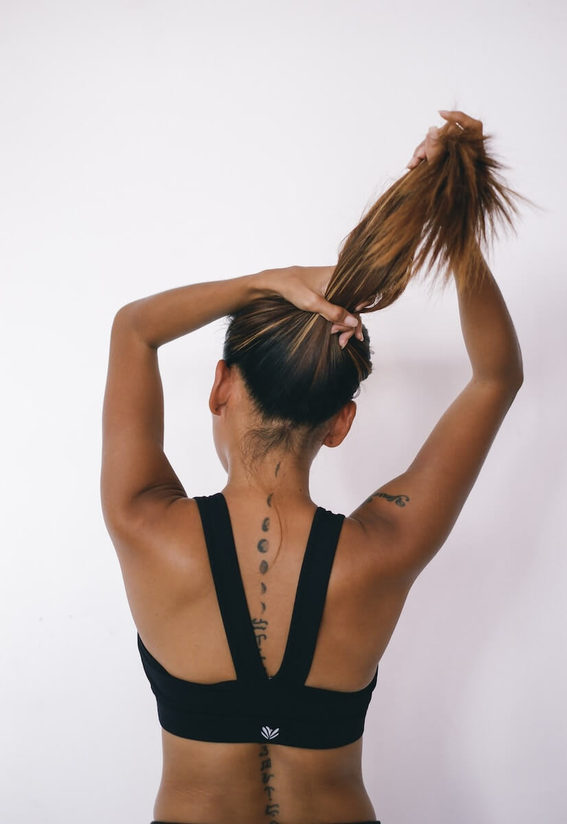 Woman putting her hair up